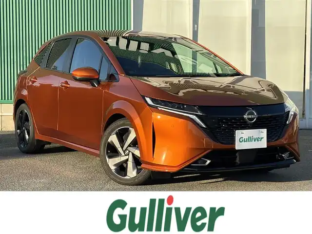 日産 オーラ G レザーエディション 福岡県 2022(令4)年 5.9万km プレミアムコロナオレンジ プロパイロット/BOSEサウンドシステム/純正ナビ（BT/フルセグ/AM/FM/HDMI)/アラウンドビューモニター/Bカメラ/フロントカメラ/サイドカメラ/レーダークルーズコントロール/LEDヘッドライト/オートマチックハイビーム/オートライト/レザーシート/純正17インチAW/ステアリングスイッチ/AutoHold/横滑り防止装置/コーナーセンサー/盗難防止装置/衝突被害軽減システム/保証書/スマートキー/ETC2.0