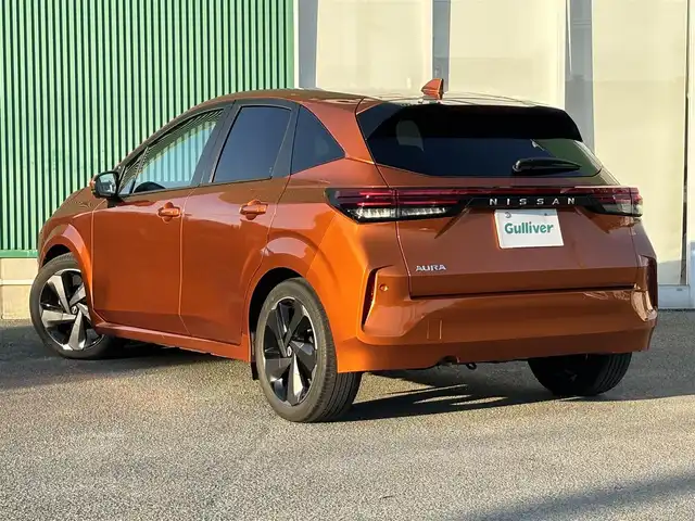 日産 オーラ G レザーエディション 福岡県 2022(令4)年 5.9万km プレミアムコロナオレンジ プロパイロット/BOSEサウンドシステム/純正ナビ（BT/フルセグ/AM/FM/HDMI)/アラウンドビューモニター/Bカメラ/フロントカメラ/サイドカメラ/レーダークルーズコントロール/LEDヘッドライト/オートマチックハイビーム/オートライト/レザーシート/純正17インチAW/ステアリングスイッチ/AutoHold/横滑り防止装置/コーナーセンサー/盗難防止装置/衝突被害軽減システム/保証書/スマートキー/ETC2.0