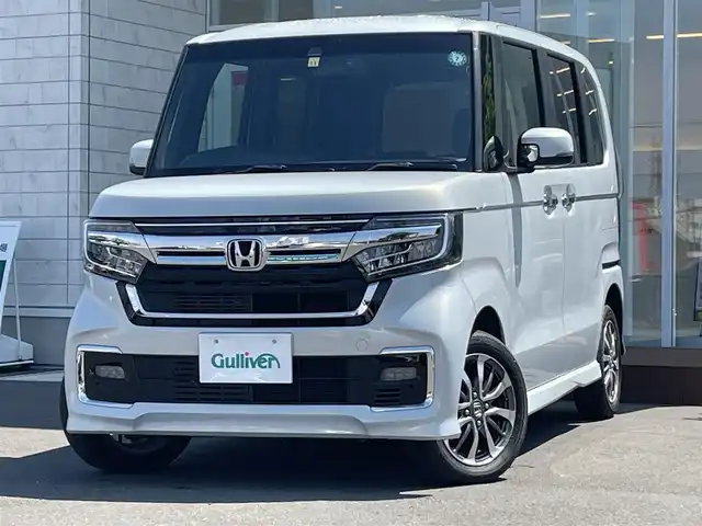 ホンダ Ｎ ＢＯＸ カスタム L 道央・札幌 2022(令4)年 1.4万km プレミアムサンライトホワイトパール ・４WD/・ワンオーナー/・ホンダセンシング/・両側パワースライドドア/・社外ナビ/　CD＆DVD＆BT＆TV/・バックカメラ/・コーナーセンサー/・レーンキープアシスト/・レーダークルーズコントロール/・純正エンジンスターター/・前後ドライブレコーダー/・オートエアコン/・オートライト/・ミラーヒーター/・シートヒーター/・電動格納ミラー/・プッシュスタート/・スマートキー/・ステアリングスイッチ/・純正フロアマット/・ウィンカーミラー/・フォグライト