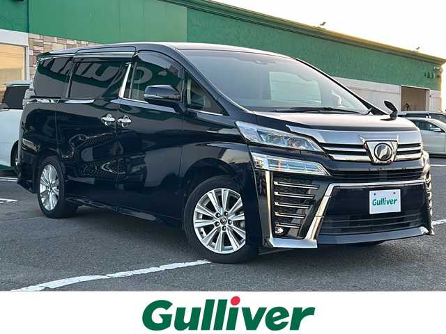 トヨタ ヴェルファイア Z 徳島県 2018(平30)年 8.1万km スパークリングブラックパールクリスタルシャイン 純正９インチナビ　/　NSZT-Y68T/HDMI/SD/USB/DVD/CD/AM/FM/Bluetooth/バックカメラ/フルセグＴＶ/（走行視聴可）/両側電動スライドドア/純正１２．１インチフリップダウンモニター/（V12T-R58C）　/前後コーナーセンサー/レーダークルーズコントロール　/ＬＥＤヘッドライト/オートマチックハイビーム/オートライト/社外シートカバー/3列シート/オットマン/前純正ドライブレコーダー/レーンキープアシスト/ロードサインアシスト/純正フロアマット/サイドバイザー/保証書/整備記録簿/取扱説明書