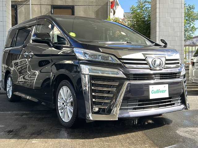 トヨタ ヴェルファイア Z 京都府 2018(平30)年 8.1万km スパークリングブラックパールクリスタルシャイン 純正９インチナビ　/　NSZT-Y68T/HDMI/SD/USB/DVD/CD/AM/FM/Bluetooth/バックカメラ/フルセグＴＶ/（走行視聴可）/両側電動スライドドア/純正１２．１インチフリップダウンモニター/（V12T-R58C）　/前後コーナーセンサー/レーダークルーズコントロール　/ＬＥＤヘッドライト/オートマチックハイビーム/オートライト/社外シートカバー/3列シート/オットマン/前純正ドライブレコーダー/レーンキープアシスト/ロードサインアシスト/純正フロアマット/サイドバイザー/保証書/整備記録簿/取扱説明書