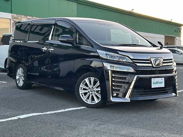 トヨタ ヴェルファイア Z 徳島県 2018(平30)年 8.1万km スパークリングブラックパールクリスタルシャイン 純正９インチナビ　/　NSZT-Y68T/HDMI/SD/USB/DVD/CD/AM/FM/Bluetooth/バックカメラ/フルセグＴＶ/（走行視聴可）/両側電動スライドドア/純正１２．１インチフリップダウンモニター/（V12T-R58C）　/前後コーナーセンサー/レーダークルーズコントロール　/ＬＥＤヘッドライト/オートマチックハイビーム/オートライト/社外シートカバー/3列シート/オットマン/前純正ドライブレコーダー/レーンキープアシスト/ロードサインアシスト/純正フロアマット/サイドバイザー/保証書/整備記録簿/取扱説明書