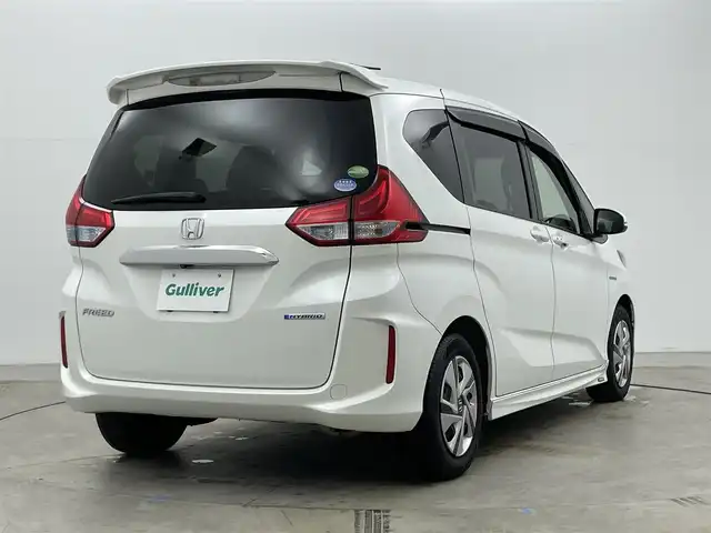 ホンダ フリード ハイブリット G 岡山県 2016(平28)年 14万km ホワイトオーキッドパール 純正ナビ/・FM/AM/Bluetooth/フルセグ/CD/DVD/バックカメラ/両側パワースライド/ETC/社外ドライブレコーダー（前後）/クルーズコントロール/スペアキー1本/盗難防止装置/横滑り防止装置/純正LEDヘッドライト/・オートライト/・フォグライト/純正フロアマット