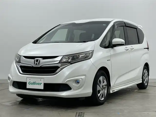 ホンダ フリード ハイブリット G 岡山県 2016(平28)年 14万km ホワイトオーキッドパール 純正ナビ/・FM/AM/Bluetooth/フルセグ/CD/DVD/バックカメラ/両側パワースライド/ETC/社外ドライブレコーダー（前後）/クルーズコントロール/スペアキー1本/盗難防止装置/横滑り防止装置/純正LEDヘッドライト/・オートライト/・フォグライト/純正フロアマット