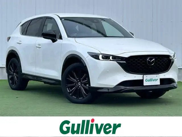 マツダ ＣＸ－５ 25S スポーツアピアランス 香川県 2021(令3)年 1.5万km スノーフレイクホワイトパールマイカ 登録時走行距離14768km/1オーナー/純正10.25型ディスプレイオーディオ/（フルセグTV/Bluetooth/USB）/純正前後ドライブレコーダー/i-ACTIVSENSE/・360°ビューモニター/・アドバンストスマートシティブレーキサポート/・レーダークルーズコントロール/・レーンキープアシスト/・車線逸脱警報システム/・ブラインドスポットモニター/・交通標識認識/・ドライバーアテンションアラート/・アダプティブフロントライティングシステム/・ハイビームコントロールシステム/LEDヘッドライト/ヘッドアップディスプレイ/電動パーキングブレーキ/オートブレーキホールド/オートワイパー/革巻きステアリング/ステアリングスイッチ/パドルシフト/ステアリングヒーター/黒革シート/前席パワーシート/前席シートヒーター/電動バックドア/ワイヤレス充電器/純正ETC/純正19インチ専用アルミホイール/純正フロアマット/トノカバー/ISOFIX/スペアキー/新車保証書/整備記録簿/取扱説明書