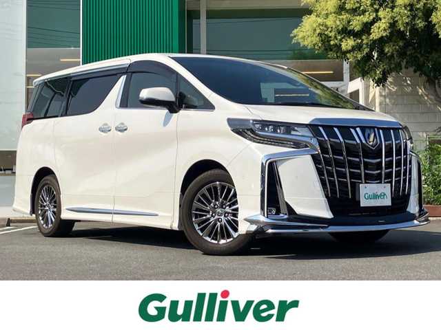 トヨタ アルファードハイブリット エグゼクティブ ラウンジ S 静岡県 2022(令4)年 2.9万km ホワイトパールクリスタルシャイン エンジンスタートボタン/パワーステアリング/パワーウィンドウ/4WD/100V充電/パーキングアシスト/アイドリングスストップ/レンタカーアップ/スマートキー/スペアキー１本/Wオートエアコン/クルーズコントロール（追従走行：有）/全方位カメラ/ビルトインETC2.0/フリップダウンモニター/USB入力端子/純正9インチSDナビ(CD/BT/フルセグ)/三列シート/サンルーフ/オットマン/電動リアゲート/ドライブレコーダー前後/純正フロアマット/D席N席パワーシート/レザーシート/1~2列目シートヒーター/1~2列目エアシート/両側パワースライドドア/モデリスタエアロ（フロント/サイド/リア）/純正17インチアルミホイール/ABS/横滑り防止装置/コーナーセンサー前後/レーンキープアシスト/オートライト/オートマチックハイビーム/三眼LEDヘッドライト/JBL/BSM(ブラインドスポットモニター)/デジタルインナーミラー/ステアリングヒーター/Wプラスサイドエアバック/衝突軽減システム/カーテンエアバック