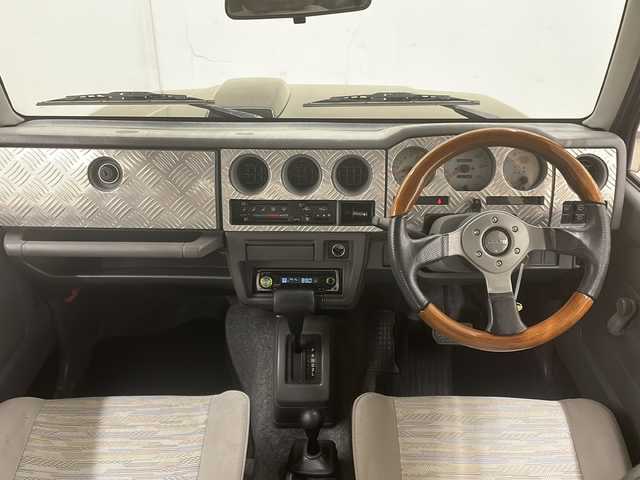 スズキ ジムニー ワイルドウィンド 道央・札幌 1997(平9)年 13.9万km ブリティッシュグリーンパール ４WD/ドアバイザー/純正アルミホイール