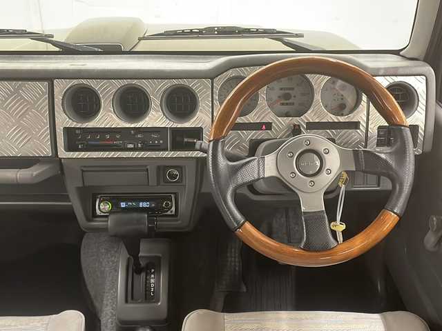 スズキ ジムニー ワイルドウィンド 道央・札幌 1997(平9)年 13.9万km ブリティッシュグリーンパール ４WD/ドアバイザー/純正アルミホイール
