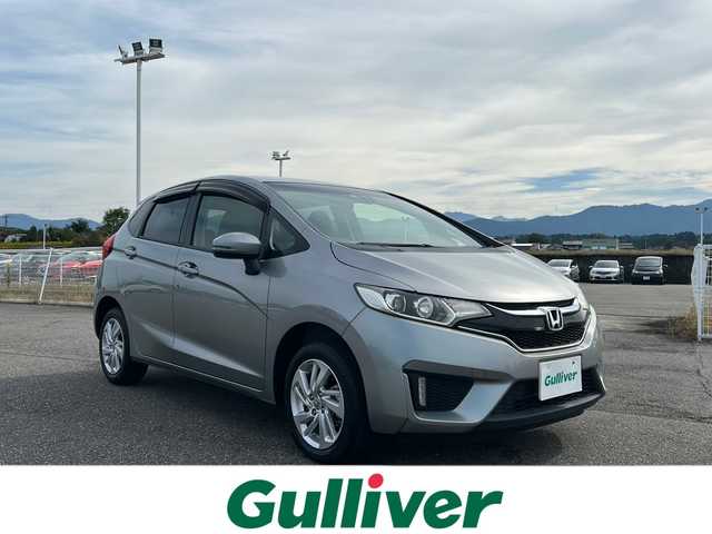 ホンダ フィット 15XL 富山県 2016(平28)年 0.3万km ティンテッドシルバーM 禁煙車/４ＷＤ/純正ＳＤナビ(地図SD無し)/ワンセグＴＶ/バックカメラ/クルーズコントロール/衝突軽減ブレーキ/アイドリングストップ/ＵＳＢ入力端子/純正フロアマット/純正アルミホイール/シートヒーター/ＥＴＣ/保証書