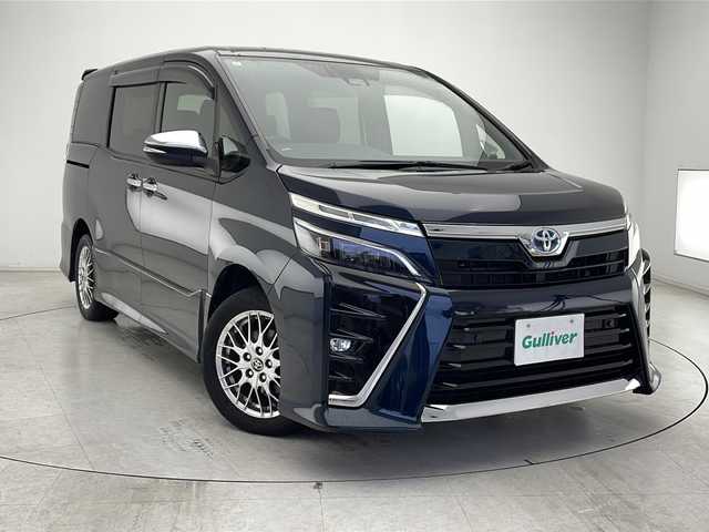 トヨタ ヴォクシー ハイブリッド ZS 煌Ⅲ 千葉県 2021(令3)年 5.2万km ブラッキッシュアゲハガラスフレーク 衝突軽減ブレーキ/両側パワースライドドア/レーンキープアシスト/フリップダウンモニター/オートマチックハイビーム/純正SDナビ/（フルセグ/Bluetooth/USB/FM/AM）/バックカメラ/ETC/シートヒーター（運転席＋助手席）/LEDヘッドライト/ヒートシーター/電動格納ミラー