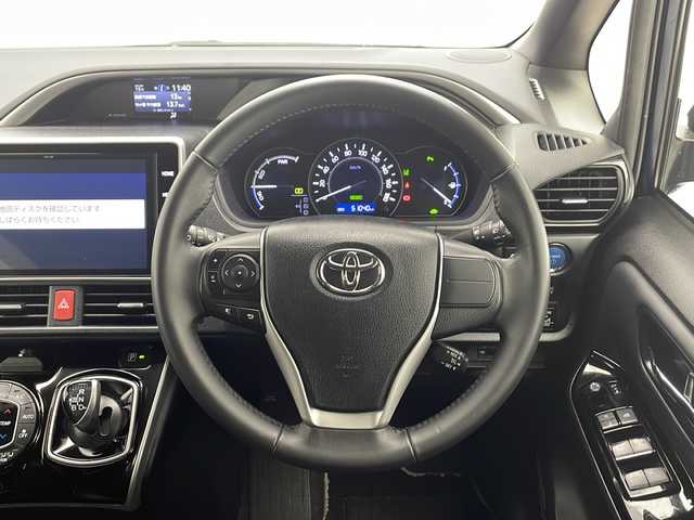 トヨタ ヴォクシー ハイブリッド ZS 煌Ⅲ 千葉県 2021(令3)年 5.2万km ブラッキッシュアゲハガラスフレーク 衝突軽減ブレーキ/両側パワースライドドア/レーンキープアシスト/フリップダウンモニター/オートマチックハイビーム/純正SDナビ/（フルセグ/Bluetooth/USB/FM/AM）/バックカメラ/ETC/シートヒーター（運転席＋助手席）/LEDヘッドライト/ヒートシーター/電動格納ミラー