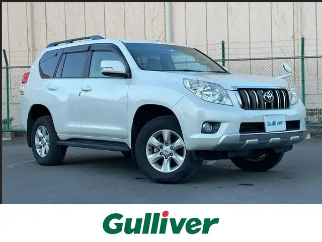 トヨタ ランドクルーザー プラド TX 東京都 2013(平25)年 2.5万km ホワイトパールクリスタルシャイン ナビ　/横滑り防止　/電格ミラー　/ビルトインＥＴＣ　/トランスファースイッチ　/ウィンドシールドデアイサー　/ヘッドライトレベライザー　/純正フロアマット　/ドアバイザー　/ステアリングスイッチ　/プッシュスタート