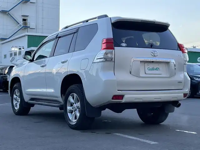 トヨタ ランドクルーザー プラド TX 東京都 2013(平25)年 2.5万km ホワイトパールクリスタルシャイン ナビ　/横滑り防止　/電格ミラー　/ビルトインＥＴＣ　/トランスファースイッチ　/ウィンドシールドデアイサー　/ヘッドライトレベライザー　/純正フロアマット　/ドアバイザー　/ステアリングスイッチ　/プッシュスタート