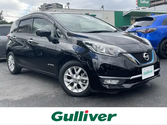 日産 ノート e－パワー メダリスト 島根県 2018(平30)年 1.5万km スーパーブラック 純正ＳＤナビ　/フルセグＴＶ　/ＤＶＤ再生　/Ｂｌｕｅｔｏｏｔｈ接続　/全方位/バック/サイド/フロントカメラ　/ＥＴＣ2.0/純正ドラレコ　/インテリジェントクルーズコントロール/前後コーナーセンサー　/純正ＬＥＤライト　/純正アルミホイール　/純正フロアマット　/保証書・取扱説明書