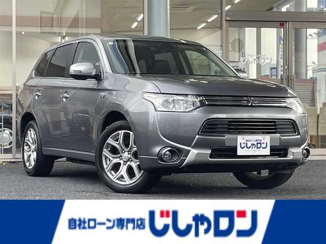 三菱 アウトランダー ＰＨＥＶ G ナビパッケージ 岐阜県 2014(平26)年 6.4万km チタニウムグレーメタリック (株)IDOMが運営する【じしゃロン多治見店】の自社ローン専用車両になります。こちらは現金またはオートローンご利用時の価格です。自社ローンご希望の方は別途その旨お申付け下さい。/メーカーオプションナビ/（BLUETOOTH/DVD/フルセグ）/4WD/レーダークルーズコントロール/レーンキープ/衝突軽減ブレーキ/バックカメラ/電動リアゲート/ALPINEフリップダウンモニター/シートヒーター/オートライト/パドルシフト/ETC/充電プラグ