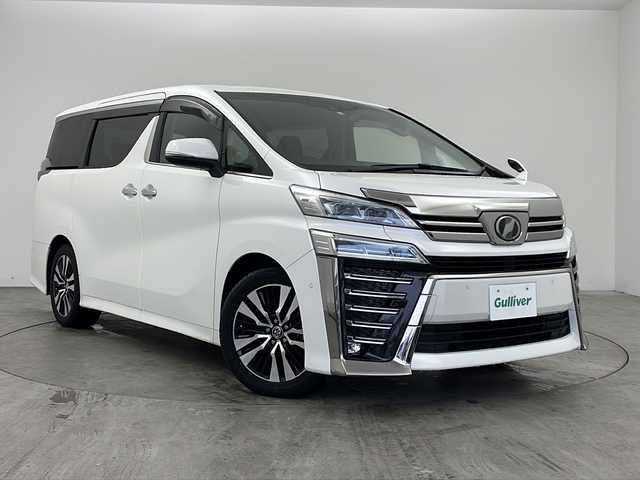 トヨタ ヴェルファイア Z Gエディション 兵庫県 2018(平30)年 5.8万km ホワイトパールクリスタルシャイン ・ワンオーナー車/・純正ナビ/CD/DVD/BT/AUX/TV/USB/HDMI/・純正フリップダウンモニター/・バックカメラ/・JBLプレミアムサウンドシステム/・シートヒーター（運転席＋助手席）/・エアシート（運転席＋助手席）/・パワーシート（１列目＋２列目）/・メモリーシート（運転席）/・黒革シート/・オットマン/・パワーバックドア/・ステアリングヒーター/・トヨタセーフティセンス/・プリクラッシュセーフティ/・レーンディパーチャーアラート/・ブラインドスポットモニター/・レーダークルーズコントロール/・電動パーキングブレーキ/・LEDオートライト/・オートマチックハイビーム/・両側パワースライドドア/・パーキングアシスト/・デジタルインナーミラー/・社外ドライブレコーダー/・ビルトインETC2.0/・スマートキー/・スペアキー/・nanoe/・純正ウッドコンビステアリング/・純正AW/・純正フロアマット