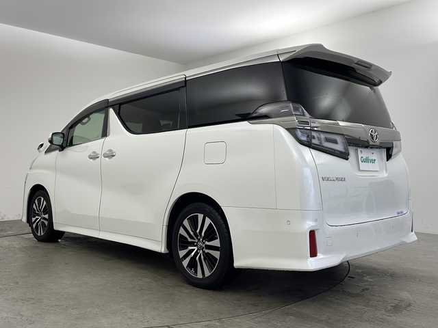 トヨタ ヴェルファイア Z Gエディション 兵庫県 2018(平30)年 5.8万km ホワイトパールクリスタルシャイン ・ワンオーナー車/・純正ナビ/CD/DVD/BT/AUX/TV/USB/HDMI/・純正フリップダウンモニター/・バックカメラ/・JBLプレミアムサウンドシステム/・シートヒーター（運転席＋助手席）/・エアシート（運転席＋助手席）/・パワーシート（１列目＋２列目）/・メモリーシート（運転席）/・黒革シート/・オットマン/・パワーバックドア/・ステアリングヒーター/・トヨタセーフティセンス/・プリクラッシュセーフティ/・レーンディパーチャーアラート/・ブラインドスポットモニター/・レーダークルーズコントロール/・電動パーキングブレーキ/・LEDオートライト/・オートマチックハイビーム/・両側パワースライドドア/・パーキングアシスト/・デジタルインナーミラー/・社外ドライブレコーダー/・ビルトインETC2.0/・スマートキー/・スペアキー/・nanoe/・純正ウッドコンビステアリング/・純正AW/・純正フロアマット