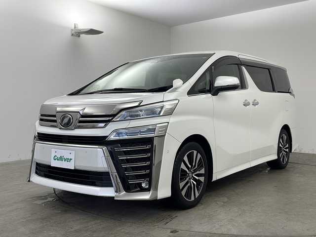 トヨタ ヴェルファイア Z Gエディション 兵庫県 2018(平30)年 5.8万km ホワイトパールクリスタルシャイン ・ワンオーナー車/・純正ナビ/CD/DVD/BT/AUX/TV/USB/HDMI/・純正フリップダウンモニター/・バックカメラ/・JBLプレミアムサウンドシステム/・シートヒーター（運転席＋助手席）/・エアシート（運転席＋助手席）/・パワーシート（１列目＋２列目）/・メモリーシート（運転席）/・黒革シート/・オットマン/・パワーバックドア/・ステアリングヒーター/・トヨタセーフティセンス/・プリクラッシュセーフティ/・レーンディパーチャーアラート/・ブラインドスポットモニター/・レーダークルーズコントロール/・電動パーキングブレーキ/・LEDオートライト/・オートマチックハイビーム/・両側パワースライドドア/・パーキングアシスト/・デジタルインナーミラー/・社外ドライブレコーダー/・ビルトインETC2.0/・スマートキー/・スペアキー/・nanoe/・純正ウッドコンビステアリング/・純正AW/・純正フロアマット