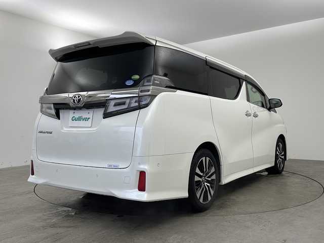 トヨタ ヴェルファイア Z Gエディション 兵庫県 2018(平30)年 5.8万km ホワイトパールクリスタルシャイン ・ワンオーナー車/・純正ナビ/CD/DVD/BT/AUX/TV/USB/HDMI/・純正フリップダウンモニター/・バックカメラ/・JBLプレミアムサウンドシステム/・シートヒーター（運転席＋助手席）/・エアシート（運転席＋助手席）/・パワーシート（１列目＋２列目）/・メモリーシート（運転席）/・黒革シート/・オットマン/・パワーバックドア/・ステアリングヒーター/・トヨタセーフティセンス/・プリクラッシュセーフティ/・レーンディパーチャーアラート/・ブラインドスポットモニター/・レーダークルーズコントロール/・電動パーキングブレーキ/・LEDオートライト/・オートマチックハイビーム/・両側パワースライドドア/・パーキングアシスト/・デジタルインナーミラー/・社外ドライブレコーダー/・ビルトインETC2.0/・スマートキー/・スペアキー/・nanoe/・純正ウッドコンビステアリング/・純正AW/・純正フロアマット