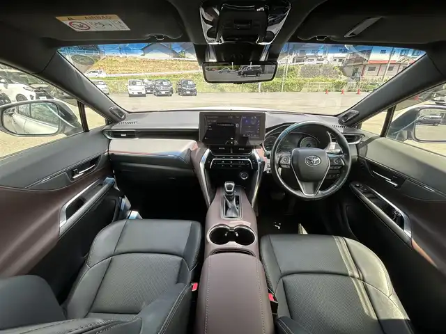 トヨタ ハリアー ハイブリッド Z レザーパッケージ 岡山県 2020(令2)年 4.6万km ホワイトパールクリスタルシャイン 12.3インチJBLサウンドディプレイオーディオ /フルセグTV、Bluetooth、Apple Carplay/Android Auto、AM、FM/パノラミックビューモニター/デジタルインナーミラー（前後録画機能付き）/モデリスタエアロ AVANT EMOTIONAL STYLE/ビルトインETC/前席パワーシート/運転席メモリーシート/前席シートヒーター/前席ベンチレーション/本革シート（ブラウン）/ステアリングヒーター/パワーバックドア/ヘッドアップディスプレイ/電動パーキングブレーキ/ブレーキホールド/トヨタセーフティセンス/・プリクラッシュセーフティ/・レーントレーシングアシスト/・レーダークルーズコントロール/・アダブティブハイビームシステム/・ロードサインアシスト/パーキングサポートブレーキ/先行車発進告知機能/車両接近通報装置/純正エンジンスターター