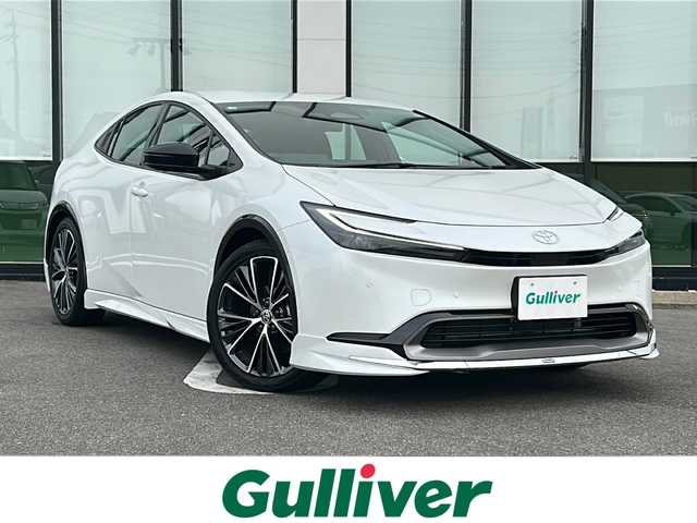 トヨタ プリウス Z 岐阜県 2025(令7)年 0.8万km プラチナホワイトパールマイカ 登録時走行距離：7533km/禁煙車/ワンオーナー/モデリスタエアロ/OPディスプレイオーディオ（ナビ機能付き）/OPデジタルインナーミラー/フルセグテレビ/パノラマビューモニター/ドライブレコーダー/トランクスポイラー/ブラインドスポットモニター/クルーズコントロール/トヨタチームメイト/コーナーセンサー/パワーバックドア/黒合皮レザーシート/シートヒーター/エアシート/ETC２．０/オートライト/オートマチックハイビーム/ワイヤレス充電器/AC１００V/純正19インチアルミホイール/プッシュスタート/スマートキー/保証書/取扱説明書/スペアキー
