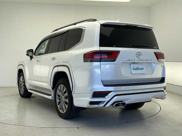 トヨタ ランドクルーザー ZX 千葉県 2024(令6)年 2万km プレシャスホワイトパール リアエンターテーメント/純正ナビ/　CD/DVD/Bluetooth/フルセグTV/　Apple car play/Android Auto/JBLサウンド/サンルーフ/リアエンターテインメント（HDMI）/モデリスタエアロパッケージA＋リアスポイラー＋マフラーカッター/ルーフレール/トヨタセーフティセンス/レーダークルーズコントロール/レーンキープアシスト/衝突軽減ブレーキ/クリアランスソナー/先行車発進警報/ロードサインアシスト/ブラインドスポットモニター/ヘッドアップディスプレイ/全方位カメラ/電動パーキング/オートホールド/オートハイビーム/ダウンヒルアシスト/クールボックス/レザーシート/前席パワーシート/運転席シートメモリー/エアーシート/シートヒーター（セカンドシートまで）/ステアリングヒーター/１００V充電/電動格納サードシート/パワーバックドア/ビルトインETC２．０/指紋認証スタートスイッチ/三眼ヘッドライト/フロアマット/ドアバイザー/トノカバー