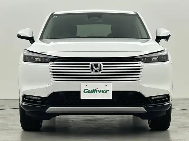 ホンダ ヴェゼル ハイブリッド e:HEV Z 福岡県 2025(令7)年 0.1万km未満 プラチナホワイトパール 登録済未使用車　/純正ナビ　/バックカメラ　/ビルトインＥＴＣ２．０　/置くだけ充電　/ＡＣＣ　/コーナーセンサー　/衝突軽減　/レーンキープ　/踏み間違い防止　/ＢＳＭ　/パドルシフト　/パワーリアゲート　/シートヒーター