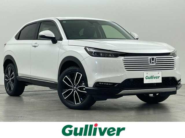 ホンダ ヴェゼル ハイブリッド e:HEV Z 福岡県 2025(令7)年 0.1万km未満 プラチナホワイトパール 登録済未使用車　/純正ナビ　/バックカメラ　/ビルトインＥＴＣ２．０　/置くだけ充電　/ＡＣＣ　/コーナーセンサー　/衝突軽減　/レーンキープ　/踏み間違い防止　/ＢＳＭ　/パドルシフト　/パワーリアゲート　/シートヒーター