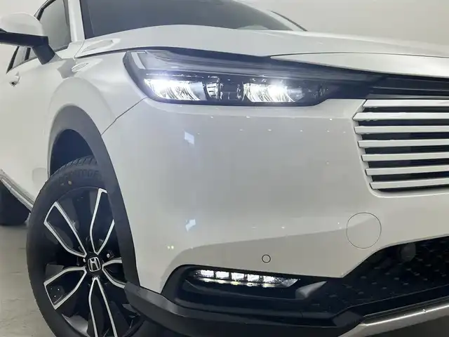 ホンダ ヴェゼル ハイブリッド e:HEV Z 福岡県 2025(令7)年 0.1万km未満 プラチナホワイトパール 登録済未使用車　/純正ナビ　/バックカメラ　/ビルトインＥＴＣ２．０　/置くだけ充電　/ＡＣＣ　/コーナーセンサー　/衝突軽減　/レーンキープ　/踏み間違い防止　/ＢＳＭ　/パドルシフト　/パワーリアゲート　/シートヒーター