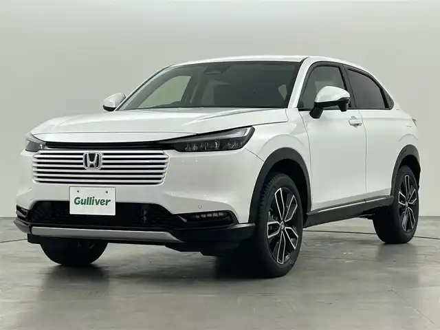 ホンダ ヴェゼル ハイブリッド e:HEV Z 福岡県 2025(令7)年 0.1万km未満 プラチナホワイトパール 登録済未使用車　/純正ナビ　/バックカメラ　/ビルトインＥＴＣ２．０　/置くだけ充電　/ＡＣＣ　/コーナーセンサー　/衝突軽減　/レーンキープ　/踏み間違い防止　/ＢＳＭ　/パドルシフト　/パワーリアゲート　/シートヒーター