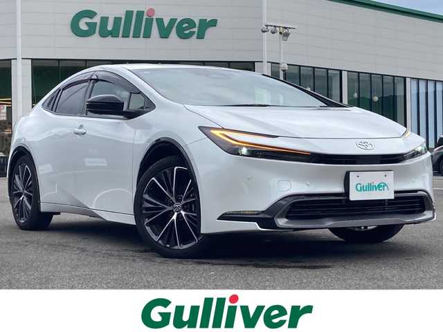 トヨタ プリウス Z 佐賀県 2023(令5)年 1.9万km プラチナホワイトパールマイカ 純正12.3インチナビ/パノラマミックビューモニター/プリクラッシュセーフティ/レーンディパーチャーアラート/ブラインドスポットモニター/クリアランスソナー/リアクロストラフィックアラート/アダプティブクルーズコントロール/オートハイビーム/デジタルインナーミラー（前方録画機能付き）/パーキングアシスト/ETC2.0/ワイアレス充電/電動パーキングブレーキ/オートブレーキホールド/ステアリングヒーター/ステアリングリモコン/AC100V/レザーシート/シートヒーター/エアシート/メモリ付きパワーシート/プッシュスタート/スマートキー/LEDヘッドライト/純正アルミホイール