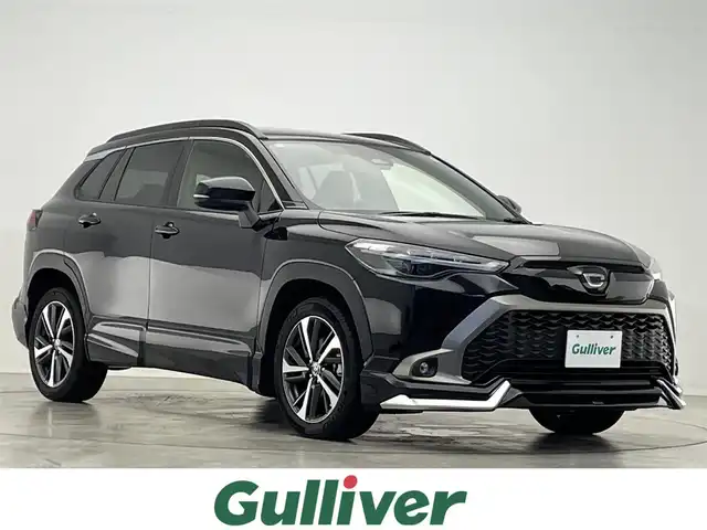 トヨタ カローラ クロス ハイブリッド Z 滋賀県 2024(令6)年 1.8万km アティチュードブラックマイカ モデリスタエアロ/パノラマルーフ/純正10.5インチナビ/・Bluetooth/USB/Miracast/フルセグ/パワーリアゲート/ハーフレザーシート/ブラインドスポットモニター/シートヒーター/バックカメラ/LEDヘッドライト/電子パーキング/前後ソナー/ステアリングリモコン/ルーフレール/純正１８AW/ビルトインETC/前後ドライブレコーダー