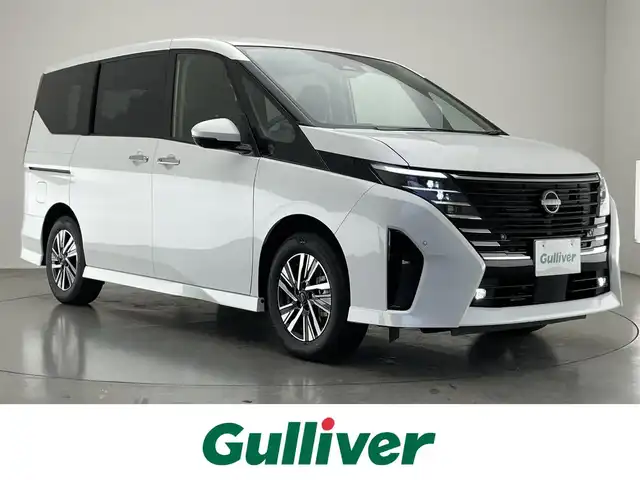 日産 セレナ e－パワー ハイウェイスター V 愛知県 2025(令7)年 0.1千km 白 登録済未使用車　純１２．３型ＤＡナビＴＶ　禁煙　純正１１型後席モニター　全方位カメラ　プロパイロット　ＢＳＭ　内蔵前後ドラレコ　デジタルインナーミラー　ＨＤＭＩ　ワイヤレス充電　衝突軽減　ハンドル支援　LEDオートライト　フォグ　コーナーセンサー/e-POWER　ハイウエイスターV　ヘッドランプ オートレベライザー+アダプティブLEDヘッドライトシステム+インテリジェント アラウンドビューモニター（移動物 検知機能付）+インテリジェント ルームミラー+アドバンスドドライブアシストディスプレイ（12.3インチカラーディスプレイ）+統合型インターフェースディスプレイ+ワイヤレス充電器+6スピーカー+NissanConnectナビゲーションシステム（地デジ内蔵）+車載通信ユニット（TCU［Telematics Control Unit］）+ETC2.0ユニット（ビルトインタイプ）+ドライブレコーダー（前後セット）+プロパイロット（ナビリンク機能付）+プロパイロット緊急停止支援システム（SOSコール機能付）+SOSコール（488/400円）後席専用モニターHDMI NissanConnectナビ付車用(125/400円)両側パワースライドドア