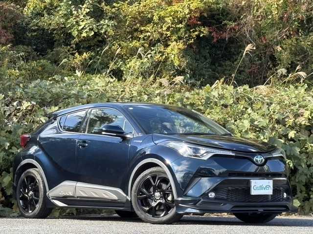 トヨタ Ｃ－ＨＲ G モード ネロ 大分県 2019(平31)年 7.1万km ブラッキッシュアゲハガラスフレーク TRDフルエアロ/トヨタセーフティセンス/ハーフレザーシート/純正メモリーナビ/バックカメラ/フルセグ /DVD/Bluetooth/シートヒーター/純正LEDヘッドライト/フォグランプ/オートライトコントロール/オートハイビームアシスト/シーケンシャルウインカー/アダプティブクルーズコントロール/レーンキープアシスト/スマートキー/エンジンプッシュスタート/ビルトインETC/純正18インチアルミ/前後クリアランスソナー