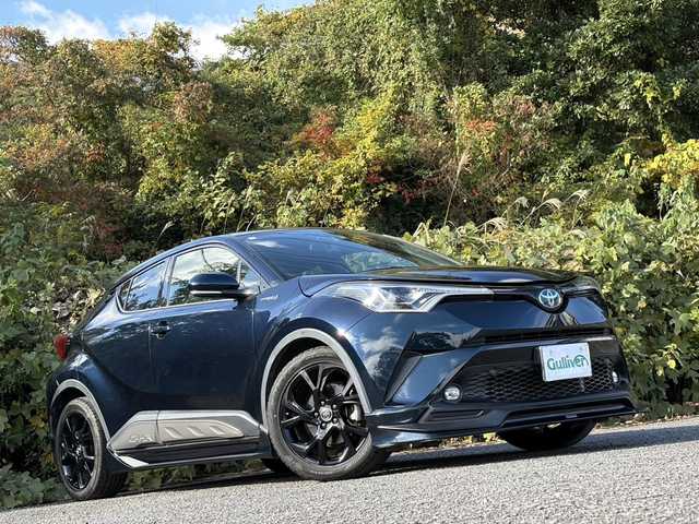 トヨタ Ｃ－ＨＲ G モード ネロ 大分県 2019(平31)年 7.1万km ブラッキッシュアゲハガラスフレーク TRDフルエアロ/トヨタセーフティセンス/ハーフレザーシート/純正メモリーナビ/バックカメラ/フルセグ /DVD/Bluetooth/シートヒーター/純正LEDヘッドライト/フォグランプ/オートライトコントロール/オートハイビームアシスト/シーケンシャルウインカー/アダプティブクルーズコントロール/レーンキープアシスト/スマートキー/エンジンプッシュスタート/ビルトインETC/純正18インチアルミ/前後クリアランスソナー