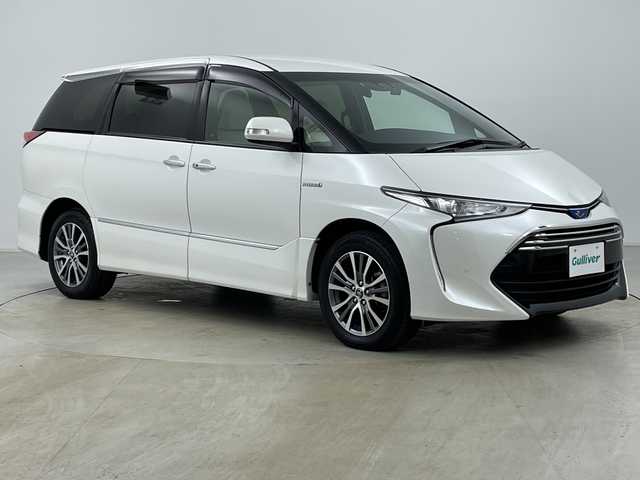 トヨタ エスティマ ハイブリッド アエラス スマート 道央・札幌 2017(平29)年 8.7万km ホワイトパールクリスタルシャイン ・4WD/・純正ナビ（NSZT-Y66T）/・CD&DVD&SD&BT&フルセグTV/・バックカメラ/・トヨタセーフティセンス/・クルーズコントロール/・純正フリップダウンモニター/・両側パワースライドドア/・レザーシート/・前席シートヒーター/・D席パワーシート/・TVキャンセラー/・ビルトインETC/・社外ドラレコ前方/・AC100V/1500W/・LEDヘッドライト/・オートライト/・オートマチックハイビーム/・スマートキー/・プッシュスタート/・保証書/・取扱説明書