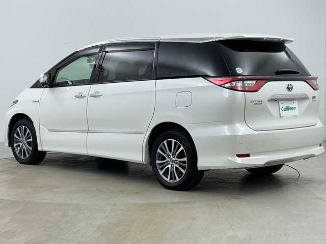 トヨタ エスティマ ハイブリッド アエラス スマート 道央・札幌 2017(平29)年 8.7万km ホワイトパールクリスタルシャイン ・4WD/・純正ナビ（NSZT-Y66T）/・CD&DVD&SD&BT&フルセグTV/・バックカメラ/・トヨタセーフティセンス/・クルーズコントロール/・純正フリップダウンモニター/・両側パワースライドドア/・レザーシート/・前席シートヒーター/・D席パワーシート/・TVキャンセラー/・ビルトインETC/・社外ドラレコ前方/・AC100V/1500W/・LEDヘッドライト/・オートライト/・オートマチックハイビーム/・スマートキー/・プッシュスタート/・保証書/・取扱説明書