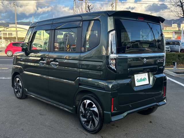 スズキ スペーシア カスタム HYBRID XS 長野県 2024(令6)年 0.4万km クールカーキPM 禁煙車/社外8インチナビ（CD/DVD/フルセグTV/Bluetooth）/セーフティサポート/・デュアルセンサーブレーキサポート/・誤発進抑制機能/・車線逸脱警報機能/・ふらつき警報機能/・先行車発進お知らせ機能/・ハイビームアシスト/・後退時ブレーキサポート/・後方誤発進抑制機能/・リアパーキングセンサー/・アダプティブクルーズコントロール/・標識認識機能/・ヘッドアップディスプレイ/バックカメラ/両側パワースライドドア/前席シートヒーター/ハーフレザーシート/ステアリングヒーター/革巻きステアリング/ステアリングスイッチ/LEDヘッドライト/フォグランプ/オートライト/電動パーキングブレーキ/ブレーキホールド/アイドリングストップ/スマートキー/Pスタート/電動格納ミラー/純正15インチAW/純正フロアマット