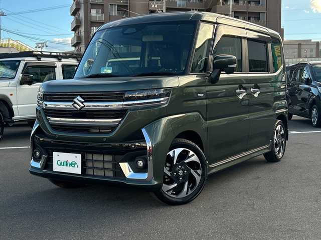 スズキ スペーシア カスタム HYBRID XS 長野県 2024(令6)年 0.4万km クールカーキPM 禁煙車/社外8インチナビ（CD/DVD/フルセグTV/Bluetooth）/セーフティサポート/・デュアルセンサーブレーキサポート/・誤発進抑制機能/・車線逸脱警報機能/・ふらつき警報機能/・先行車発進お知らせ機能/・ハイビームアシスト/・後退時ブレーキサポート/・後方誤発進抑制機能/・リアパーキングセンサー/・アダプティブクルーズコントロール/・標識認識機能/・ヘッドアップディスプレイ/バックカメラ/両側パワースライドドア/前席シートヒーター/ハーフレザーシート/ステアリングヒーター/革巻きステアリング/ステアリングスイッチ/LEDヘッドライト/フォグランプ/オートライト/電動パーキングブレーキ/ブレーキホールド/アイドリングストップ/スマートキー/Pスタート/電動格納ミラー/純正15インチAW/純正フロアマット