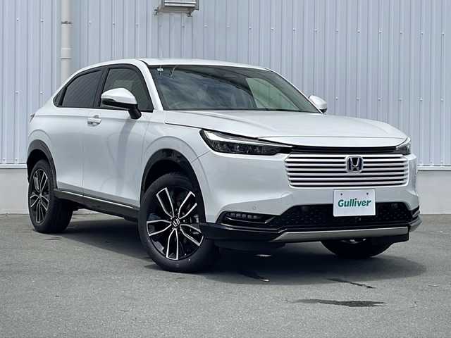 ホンダ ヴェゼル ハイブリッド e:HEV Z 三重県 2025(令7)年 0.1万km未満 プラチナホワイトパール 登録済未使用/BSM/置くだけ充電/LEDシーケンシャルウィンカー/シートヒーター(前席)/ステアリングヒーター/ハンズフリー電動リヤゲート/ホンダコネクトディスプレイナビ(TV/BT/AppleCarPlay/AndroidAuto/USB）/ホンダセンシング/ステアリングヒーター/レーンキープアシスト/レーダークルーズコントロール/横滑り防止/衝突軽減ブレーキ/パーキングセンサー/先行車発進お知らせ/電動格納ミラー/禁煙車