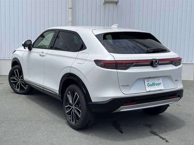 ホンダ ヴェゼル ハイブリッド e:HEV Z 三重県 2025(令7)年 0.1万km未満 プラチナホワイトパール 登録済未使用/BSM/置くだけ充電/LEDシーケンシャルウィンカー/シートヒーター(前席)/ステアリングヒーター/ハンズフリー電動リヤゲート/ホンダコネクトディスプレイナビ(TV/BT/AppleCarPlay/AndroidAuto/USB）/ホンダセンシング/ステアリングヒーター/レーンキープアシスト/レーダークルーズコントロール/横滑り防止/衝突軽減ブレーキ/パーキングセンサー/先行車発進お知らせ/電動格納ミラー/禁煙車