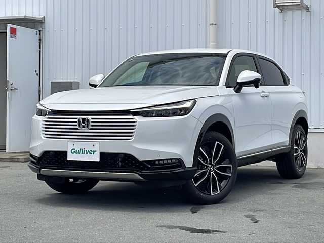 ホンダ ヴェゼル ハイブリッド e:HEV Z 三重県 2025(令7)年 0.1万km未満 プラチナホワイトパール 登録済未使用/BSM/置くだけ充電/LEDシーケンシャルウィンカー/シートヒーター(前席)/ステアリングヒーター/ハンズフリー電動リヤゲート/ホンダコネクトディスプレイナビ(TV/BT/AppleCarPlay/AndroidAuto/USB）/ホンダセンシング/ステアリングヒーター/レーンキープアシスト/レーダークルーズコントロール/横滑り防止/衝突軽減ブレーキ/パーキングセンサー/先行車発進お知らせ/電動格納ミラー/禁煙車