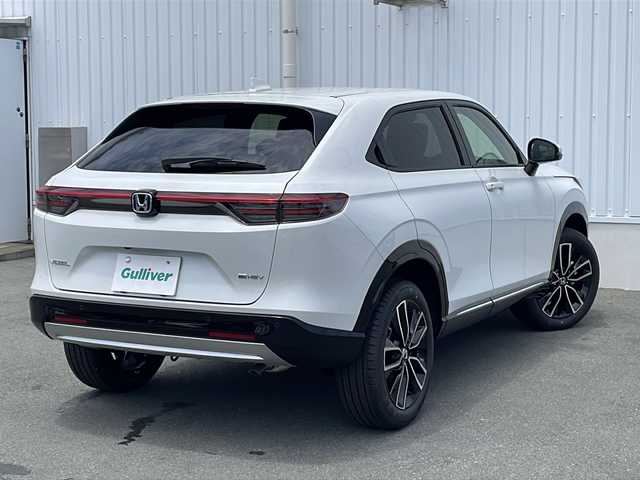 ホンダ ヴェゼル ハイブリッド e:HEV Z 三重県 2025(令7)年 0.1万km未満 プラチナホワイトパール 登録済未使用/BSM/置くだけ充電/LEDシーケンシャルウィンカー/シートヒーター(前席)/ステアリングヒーター/ハンズフリー電動リヤゲート/ホンダコネクトディスプレイナビ(TV/BT/AppleCarPlay/AndroidAuto/USB）/ホンダセンシング/ステアリングヒーター/レーンキープアシスト/レーダークルーズコントロール/横滑り防止/衝突軽減ブレーキ/パーキングセンサー/先行車発進お知らせ/電動格納ミラー/禁煙車