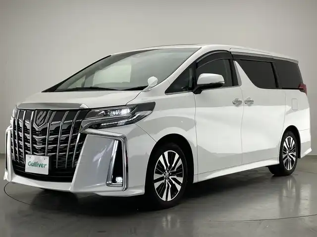 トヨタ アルファード S Cパッケージ 愛知県 2021(令3)年 5.5万km ホワイトパールクリスタルシャイン 純正ディスプレイナビ　フルセグＴＶ　ＤＶＤデッキ　ツインムーンルーフ　純正12.1型後席モニター　ＢＳＭ　黒革　シートヒーター　エアシート　デジタルインナーミラー　両側パワスラ　トヨタセーフティセンス　衝突軽減　追従クルコン　車線逸脱　ＡＣ１００Ｖ電源　三眼LEDライト　フォグランプ　オートライト　ステアリングヒーター　オットマン　電動パーキングブレーキ　電度リアゲート　ステアリングスイッチ　BSM　禁煙車