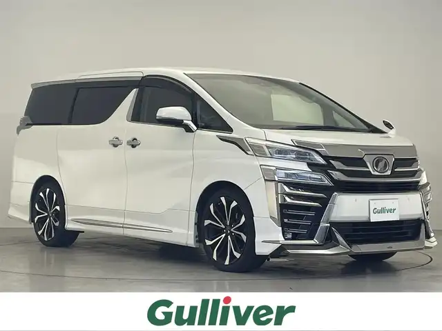 トヨタ ヴェルファイア Z Gエディション 滋賀県 2018(平30)年 7.8万km ホワイトパールクリスタルシャイン 禁煙車/モデリスタエアロ（フロント・サイド・リア）/モデリスタ20インチアルミ/純正10型ナビ/【Bluetooth/フルセグTV/SD/USB/HDMI】/フリップダウンモニター/デジタルインナーミラー/ドライブレコーダー/ビルトインETC/革シートセット/・革シート/・快適温熱シート（2列目シート）/・アクセサリーコンセント（4個）/・読書灯/トヨタセーフティセンス/・プリクラッシュセーフティ/・ロードサインアシスト/・レーントレーシングアシスト/・レーダークルーズコントロール/・オートマチックハイビーム/エグゼクティブパワーシート/パワーバックドア/両側パワースライドドア/LEDライト