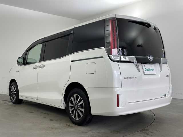 トヨタ エスクァイア ハイブリッド Xi 兵庫県 2018(平30)年 3.4万km ホワイトパールクリスタルシャイン ・ワンオーナー/・トヨタセーフティーセンス/・プリクラッシュセーフティ/・レーンディバチャーアラート/・先行車発進お知らせ/・オートマチックハイビーム/・クルーズコントロール/・純正9インチナビ＆TV＆BT＆HDMI＆DVD/・バックカメラ/・両側パワースライドドア/・スマートキー/・スペアキー/・プッシュスタート/・ビルトインETC/・前方ドライブレコーダー/・前席シートヒーター/・横滑り防止装置/・フロアマット/・ステアリングスイッチ/・後席サンシェード/・LEDライト/・フォグ/・オートライト/・電動格納ミラー/・シートリフター/・純正15インチアルミホイール