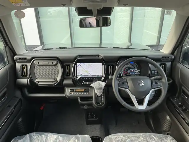 スズキ ハスラー HYBRID X 香川県 2025(令7)年 0.1千km クールカーキパールメタリック/ソフトベージュメタリック HV　X　全方位モニター付きナビゲーション＆スズキセーフティサポート(217800円)/登録時走行距離：5km/届出済未使用車/メーカー純正9型メモリナビ/　CD DVD BT フルセグTV/全方位カメラ/デュアルカメラブレーキサポート/レーンキープアシスト/レーダークルーズコントロール/クリアランスソナー/LEDヘッドライト/オートライト/フォグランプ/レベライザヘッドライト/横滑り防止装置/アイドリングストップ/ハーフレザーシート/シートヒーター/革巻きステアリング/ステアリングスイッチ/プッシュスタート/スマートキー/スペアキー/取扱説明書/保証書