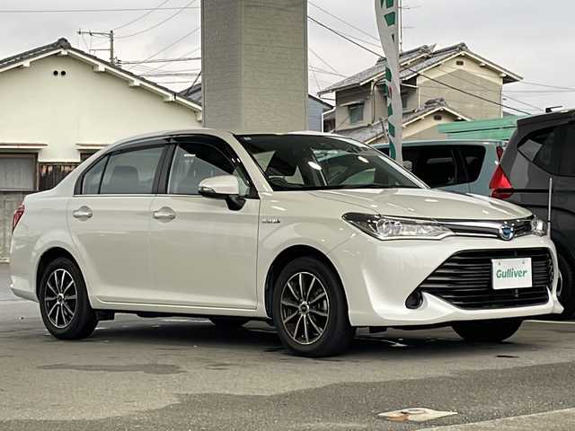 トヨタ カローラ アクシオ ハイブリッドG 愛媛県 2016(平28)年 8.9万km ホワイトパールクリスタルシャイン 純正ナビ/・ワンセグ/CD/BT/バックカメラ/プリクラッシュセーフティ/レーンキープアシスト/オートハイビーム/ステアリングスイッチ/オートライト/ウィンカーミラー/リモコンキー/電格ミラー