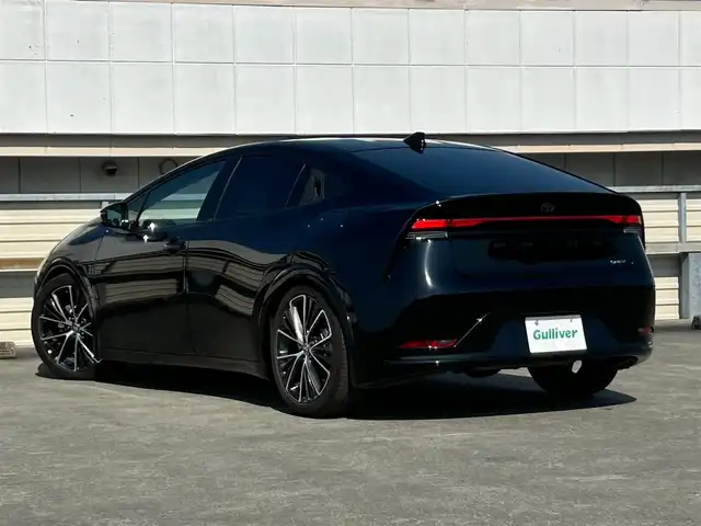 トヨタ プリウス Z 静岡県 2023(令5)年 3.8万km アティチュードブラックマイカ トヨタチームメイト/アドバンストパーク（駐車支援機能）/トヨタセーフティセンス/・レーダークルーズコントロール/・プリクラッシュセーフティー/・レーンディパーチャーアラート/・ブラインドスポットモニター/・クリアランスソナー/・後方車両接近告知/・パーキングサポートブレーキ/・ロードサインアシスト/・リヤクロストラフィックアラート/・プロアクティブドライビングアシスト/・リヤカメラディテクション/・安心降車アシスト/12.3型ディスプレイオーディオ/（TVキット付/走行中視聴可能）/ナビ機能なし/・BT.AM.FM.Miracast.USB/パノラミックビューモニター/デジタルインナーミラー/パワーバックドア/パワーシート/メモリ機能有り/合皮シート/シートヒーター /シートベンチレーション/ビルトインETC2.0/ダウンサス（RSR Ti2000)/ワイヤレス充電/ハンドルヒーター/純正19インチAW/AC100V1500W/純正フロアマット/LEDヘッドライト/ステアリングスイッチ