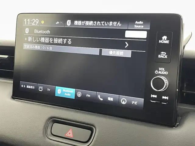 ホンダ ヴェゼル ハイブリッド e:HEV Z 熊本県 2025(令7)年 0.1万km未満 プラチナホワイトパール 登録済未使用車/純正ナビ（ＡｐｐｌＣａｒＰｌａｙ・ＡｎｄｒｏｉｄＡｕｔｏ・フルセグ・ＢＴ・ＵＳＢ）　/バックカメラ　/ビルトインＥＴＣ　/ホンダセンシング/・衝突軽減ブレーキ/・誤発進抑制機能/・後方誤発進抑制機能/・近距離衝突軽減ブレーキ/・歩行者事故低減ステアリング/・路外逸脱制御機能/・アダブティブクルーズコントロール/・渋滞運転支援機能/・先行車発進お知らせ/・標識認識システム/・ブラインドスポットモニター/・車線維持支援システム/・オートハイビーム/横滑り防止/ダウンヒルアシスト/置くだけ充電/前席シートヒーター/ステアリングヒーター/パワーバックドア/パドルシフト/ブレーキホールド/ハーフレザーシート/純正１８インチAW/フロントシーケンシャルウインカー/オートライト/LEDヘッドライト/フォグライト/スマートキー/プッシュスタート/スペアキー1本/保証書/取扱説明書